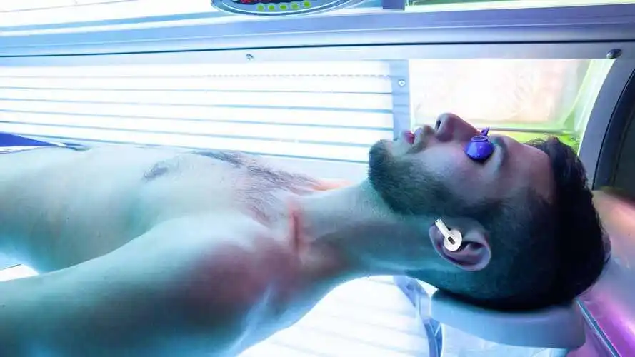 man using airpods 2nd generation in tanning bed man using airpods 2nd generation in tanning bed